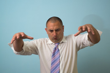 An angry businessman pointing at you