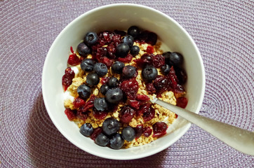 High Angle View of Summer Berry Cereal on Purple Placemat