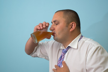 Fototapeta premium Businessman with a bottle of beer