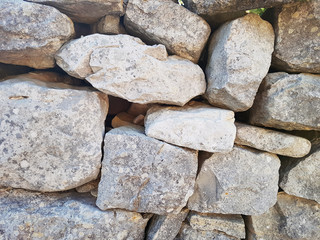 gray wall of stones background texture