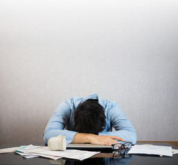 Fall asleep on work desk, stress and study hard concept