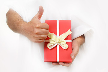 red gift in male hands over white background