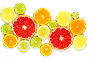 Fototapeta na wymiar top view of slices of citrus fruits isolated on white background