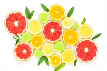 Fototapeta na wymiar citrus food pattern on white background - assorted citrus fruits with mint leaves. Isolated on white background