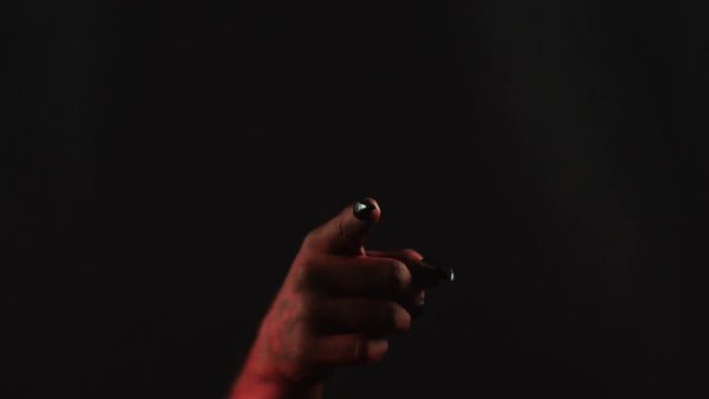 Pointing finger at the camera, gesture by demon hand.