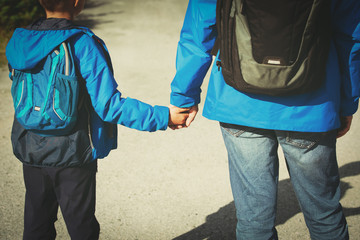 father and son on going to school