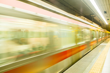 Fototapeta na wymiar Train in motion blur in subway station.