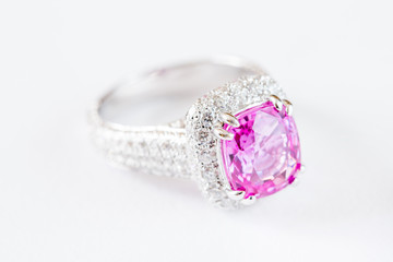 Ring of the jewelry with pink sapphire isolated on white background