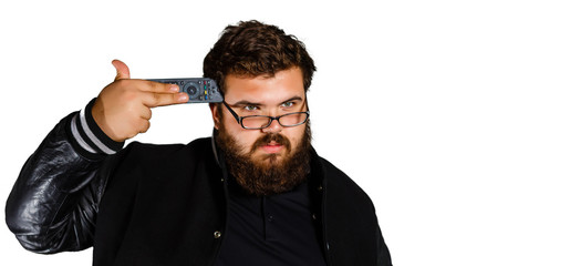 portrait of a young angry man using a remote control indoor