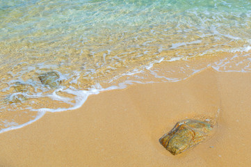 Soft Wave Of Blue Ocean On Sandy Beach. Background. Selective focus