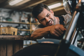 automechanic fixing motorbike