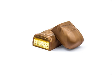 Chocolate bar with caramel isolated on white background. Clipping path included.