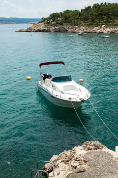 White fishing boat moored in Adriatic sea