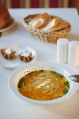 Delicious vegetable soup at the table of restaurant or cafe.