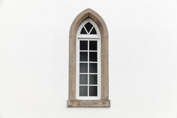 Fototapeta na wymiar Window in white stone wall, Gothic Revival