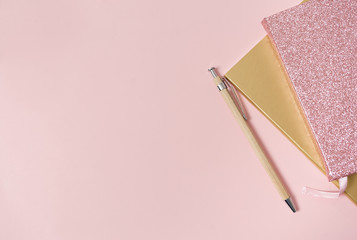 flat lay image of workplace, notebooks and pen
