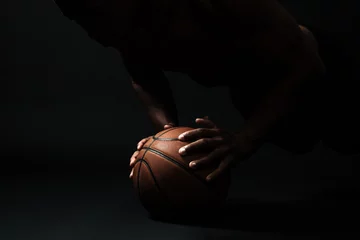 Zelfklevend Fotobehang Cropped photo of afro american basketball player,  doing pushup exercise on the ball © Drobot Dean