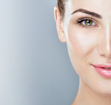 Fototapeta Beautiful face of young adult woman with clean fresh skin.