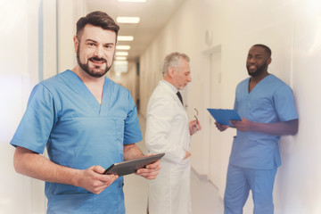 Obraz premium Portrait of positive man that posing on camera