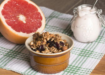 Granola from several types of cereals with nuts,coconut chips and dried cranberry.