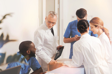 Group of colleagues having interesting conversation