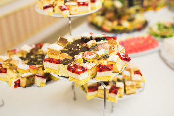 Different kinds of baked sweets on a buffet