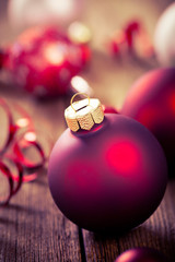 christmas baubles on wooden board