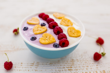 A bowl of healthy and delicious smoothie with fresh berry fruit. 