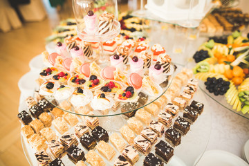 Different kinds of baked sweets on a buffet