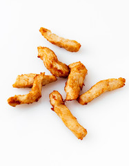 Fried chicken breast strips on white background