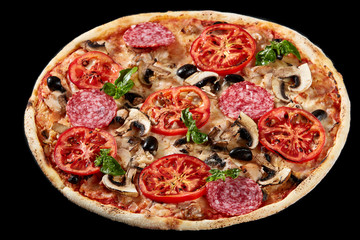 Food ingredients in pizza on black concrete background.
