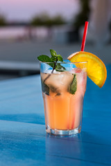 Special cocktail from the barman. Pouring alcohol to cocktail glass.