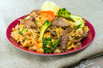 Homemade Chinese fried rice with vegetables and fried beef