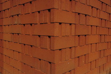 Stack of red clay bricks