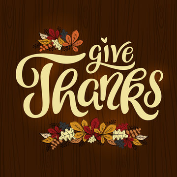 Give Thanks - Thanksgiving lettering card. Hand drawn text with decorative autumn leaves illustration. Vector, eps 10.