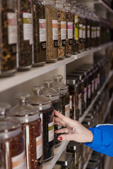 many glass jars with tea