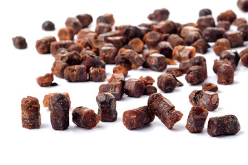 Granules of bee bread isolated on a white background. Apitherapy. Beekeeping products. Strengthening immunity.