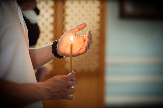 hand with a candle