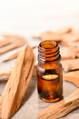Sandalwood essential oil on the wooden board