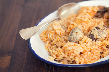 rice with seafood and fish on dish