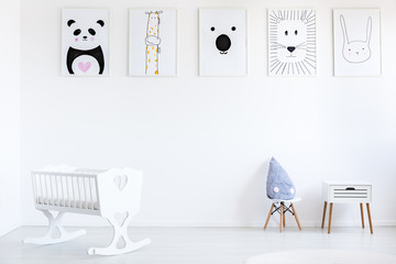 White baby's bedroom with posters