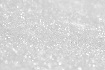 Texture of shiny white snow. Background for New Year's greeting card.