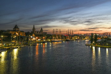 Final The Tall Ships Races in Szczecin 2017. Ships and cityscape by night.