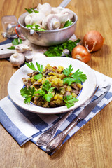 Champignon mushrooms on wooden table