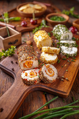 Soft cheeses rolled in herbs and spieces