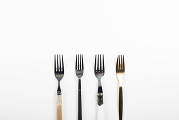 Forks on white background. Copy space.