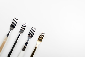 Forks on white background. Copy space.