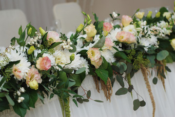 Decoration of Wedding table with Flowers.