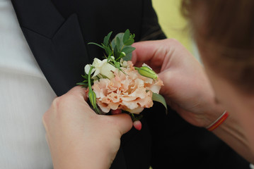 Wedding posy on the lapel of groom's jacket