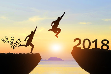 Men jump Happy New Year 2017 to 2018